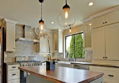 painted cream cabinets clear pendant light