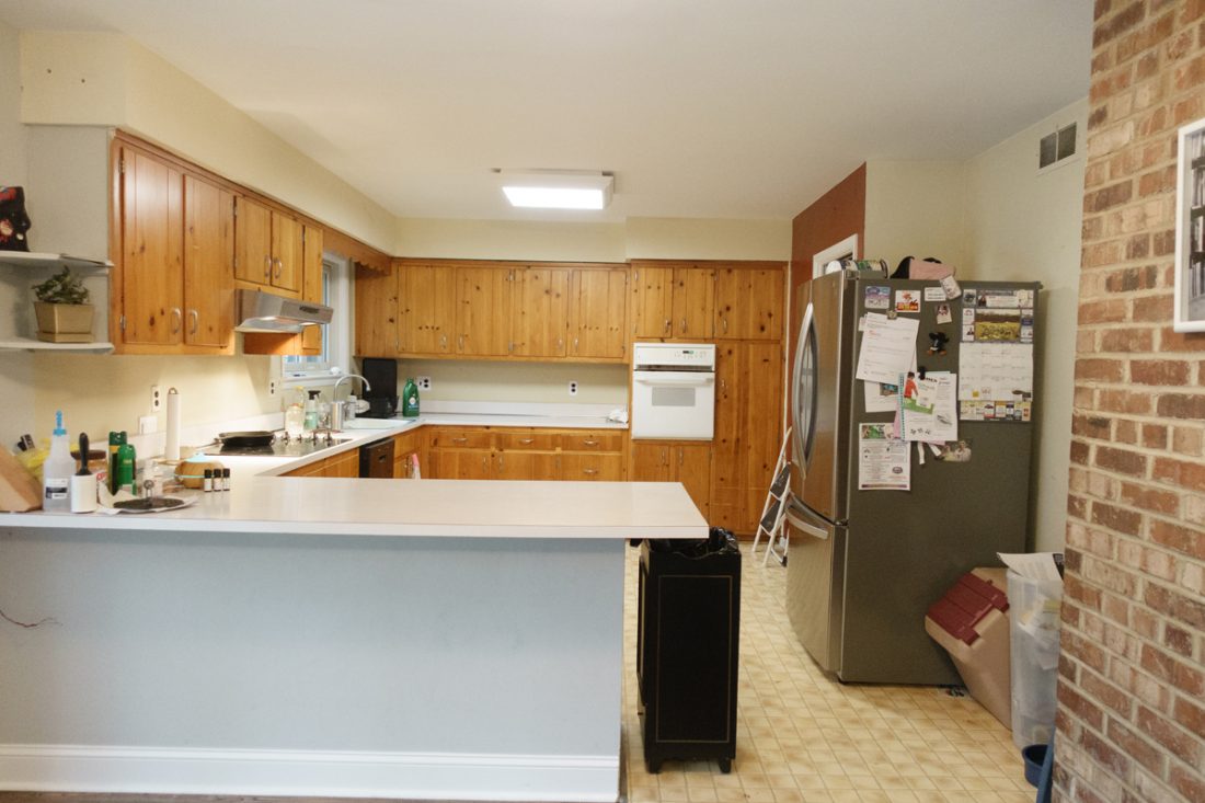 This kitchen was dated with old wood cabinets and a no designated space for the refrigerator This kitchen was dated with old wood cabinets and a no designated space for the refrigerator