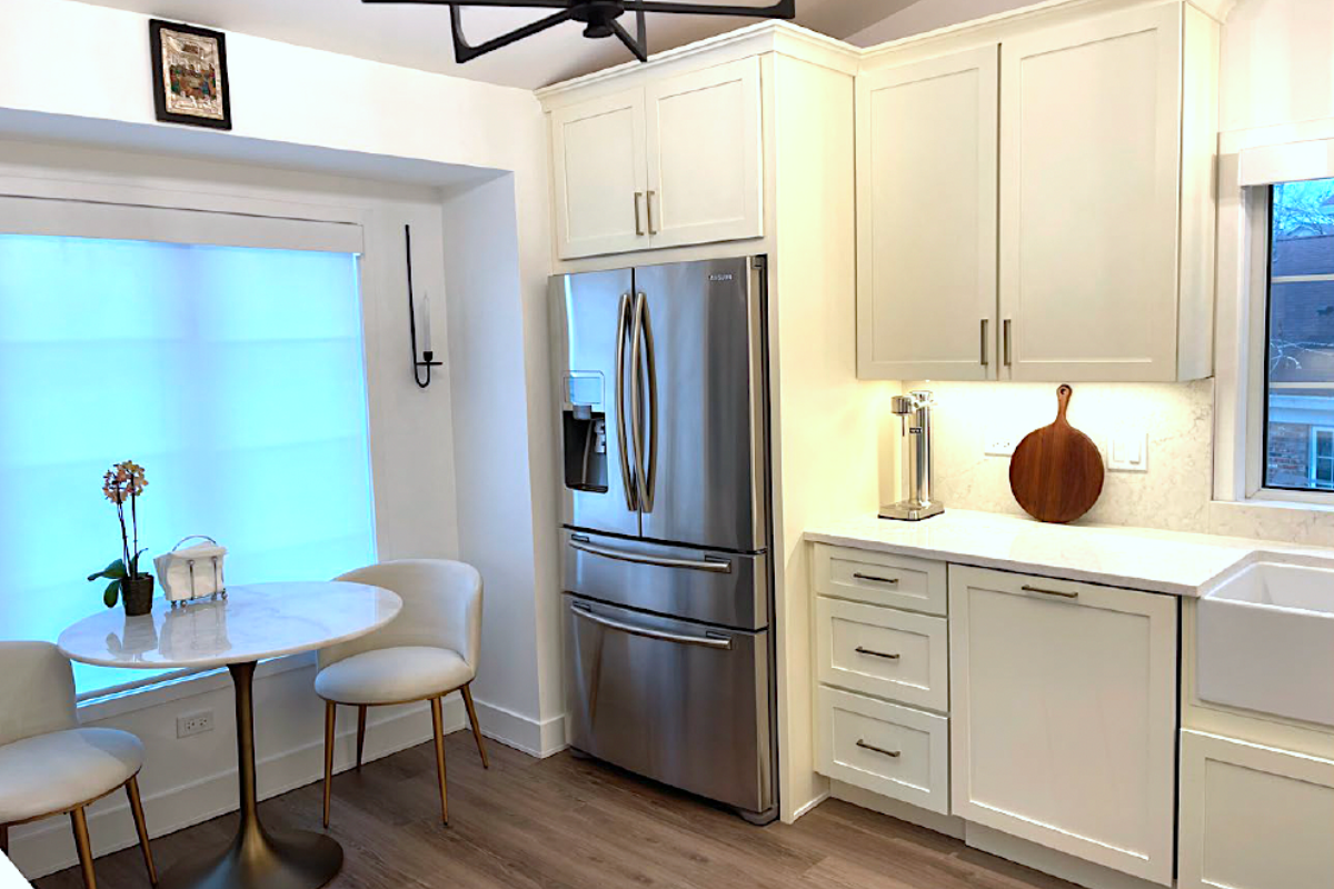 CliqStudios project: cream-colored shaker kitchen cabinets with a stainless steel french door refrigerator and small eat-in marble kitchen table CliqStudios project: cream-colored shaker kitchen cabinets with a stainless steel french door refrigerator and small eat-in marble kitchen table