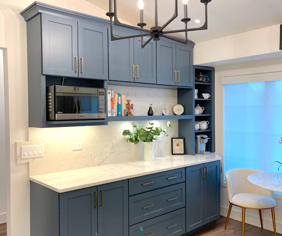 CliqStudios project: Blue shaker kitchen cabinets in a coffee bar with a microwave shelf and light cream colored quartz countertops and backsplash CliqStudios project: Blue shaker kitchen cabinets in a coffee bar with a microwave shelf and light cream colored quartz countertops and backsplash