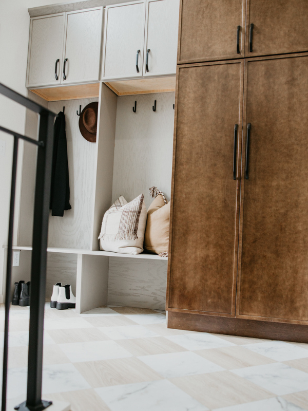 Entryway mudroom cabinets and bench in skinny shaker door style with light gray and medium brown finishes