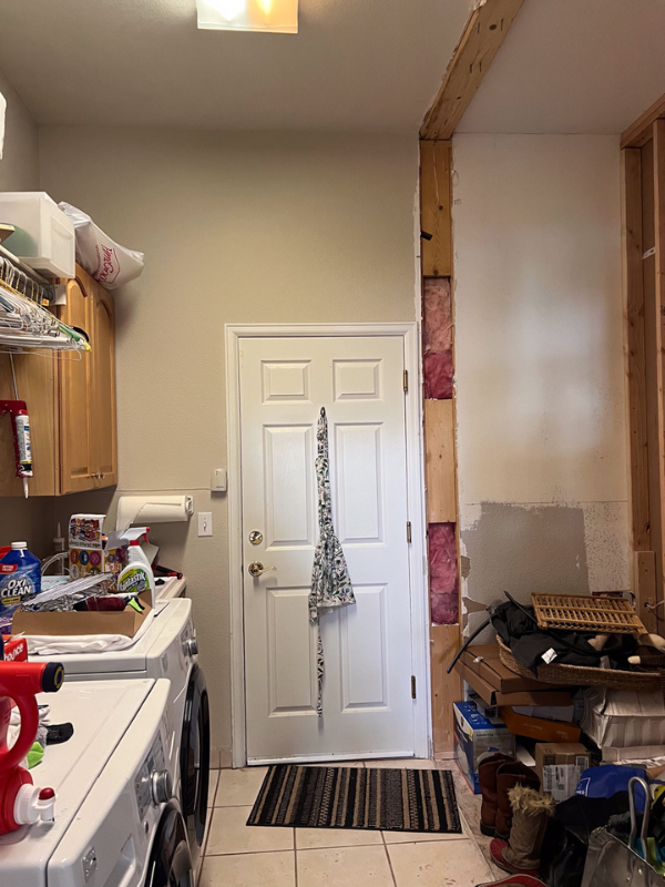 Before photo with a wall torn down on the right that led into the old dining room making space for new laundry room Before photo with a wall torn down on the right that led into the old dining room making space for new laundry room