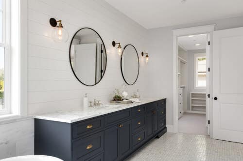 Black inset bathroom vanity with gold hardware Black inset bathroom vanity with gold hardware and white countertops