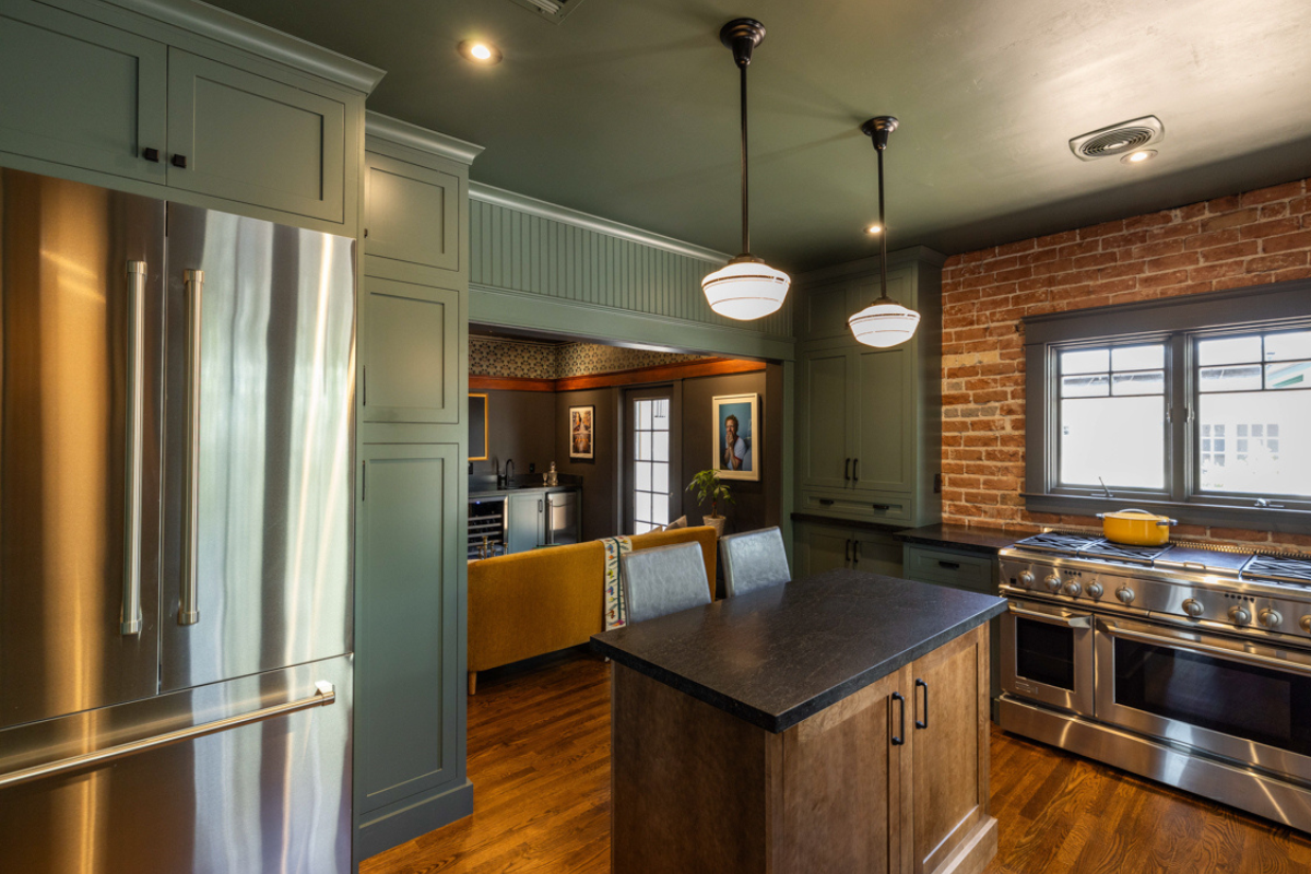Medium green inset kitchen cabinet design with dark wood island Medium green inset kitchen cabinet design with dark wood island in vintage style