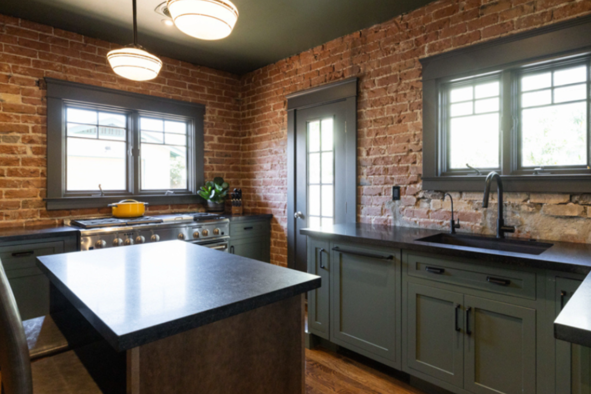 Craftsman style dark green kitchen cabinet design with black honed granite countertops Craftsman style dark green kitchen cabinet design with black honed granite countertops