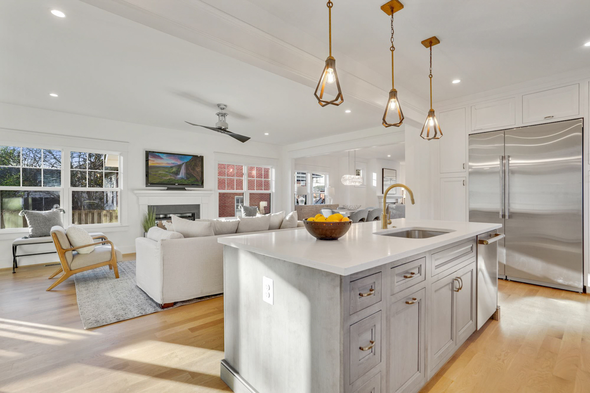 Stacked white shaker inset kitchen cabinets with a light gray stained island and white quartz countertops Stacked white shaker inset kitchen cabinets with a light gray stained island and white quartz countertops