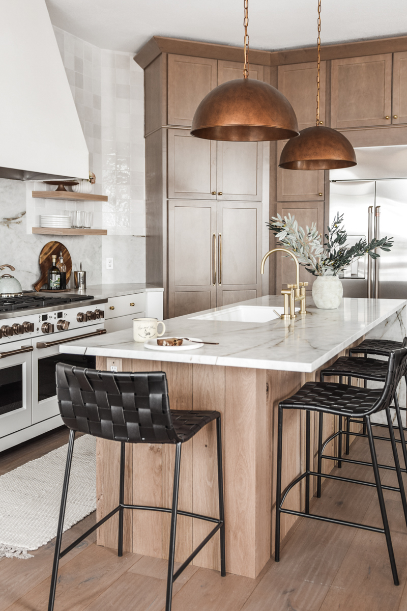 White shaker kitchen cabinets with a light wood shaker cabinet refrigerator surround and island White shaker kitchen cabinets with a light wood shaker cabinet refrigerator surround and island