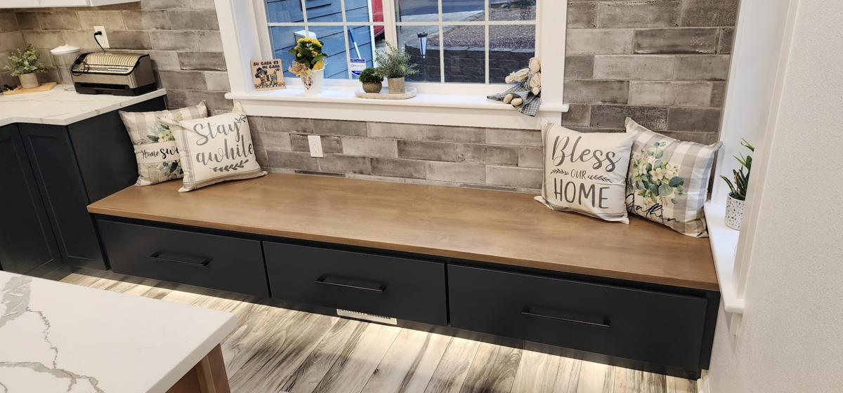 Custom blue shaker cabinet bench seat with light wood top in farmhouse style Custom blue shaker cabinet bench seat with light wood top in farmhouse style