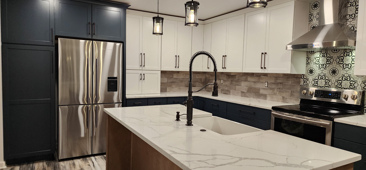 Farmhouse kitchen with white shaker wall cabinets, blue shaker base cabinets, and light wood furniture-style island Farmhouse kitchen with white shaker wall cabinets, blue shaker base cabinets, and light wood furniture-style island