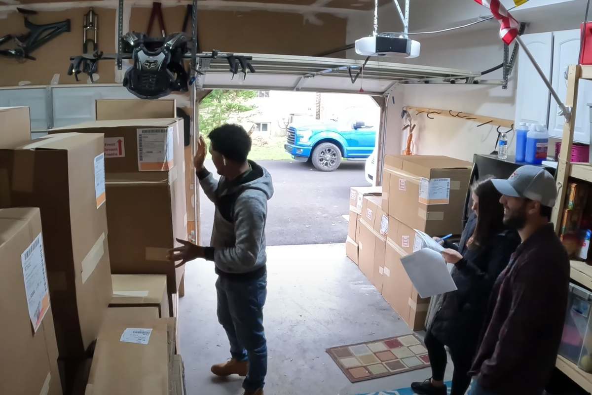 CliqStudios kitchen cabinet delivery in a garage