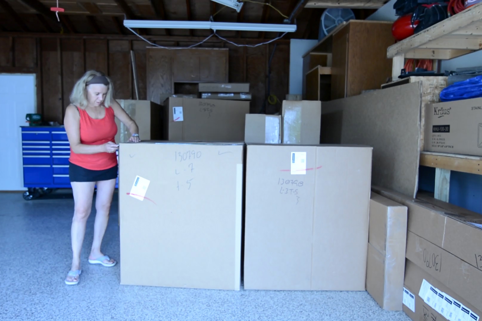 Customer taking inventory and storing kitchen cabinets safely until installation Customer taking inventory and storing kitchen cabinets safely until installation