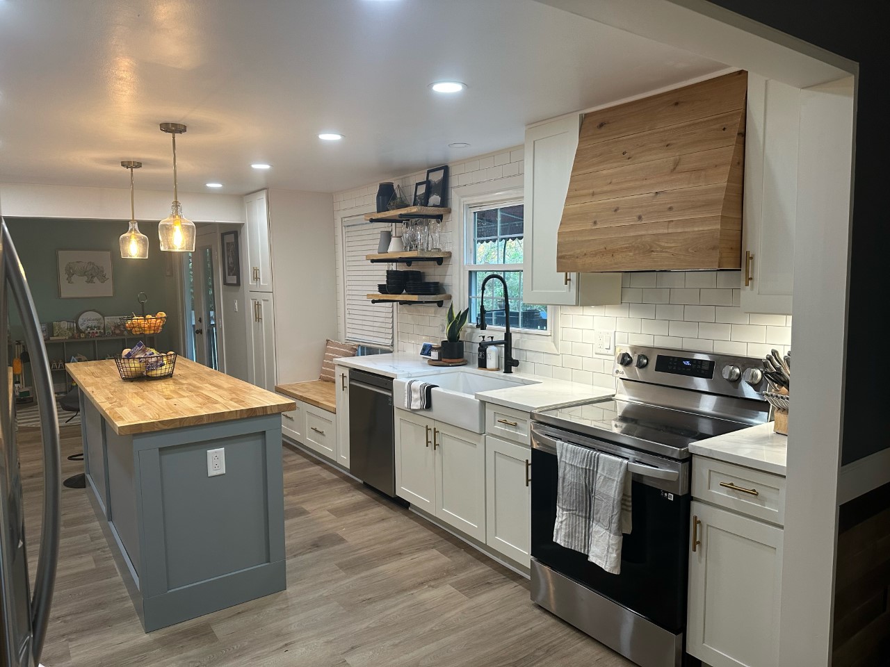 CliqStudios project: White shaker cabinets with a pine wood hood and light gray shaker island cabinets CliqStudios project: White shaker cabinets with a pine wood hood and light gray shaker island cabinets