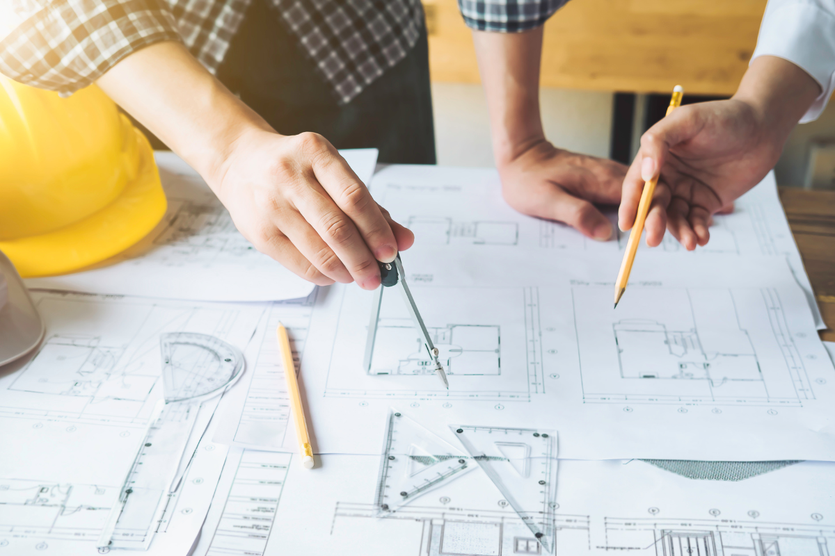 Designers collaborating on remodel drawings Designers collaborating on remodel drawings