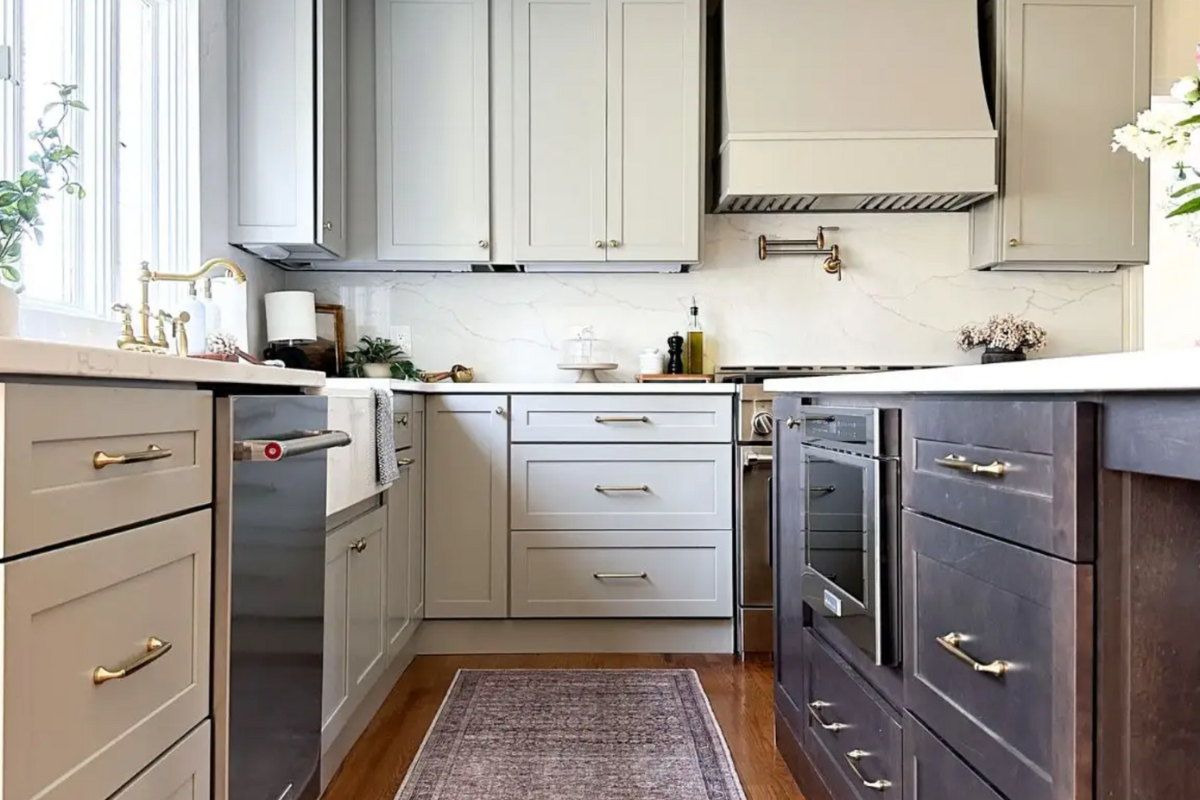 Light gray shaker kitchen design with dark wood island and farmhouse style flare Light gray shaker kitchen design with dark wood island and farmhouse style flare