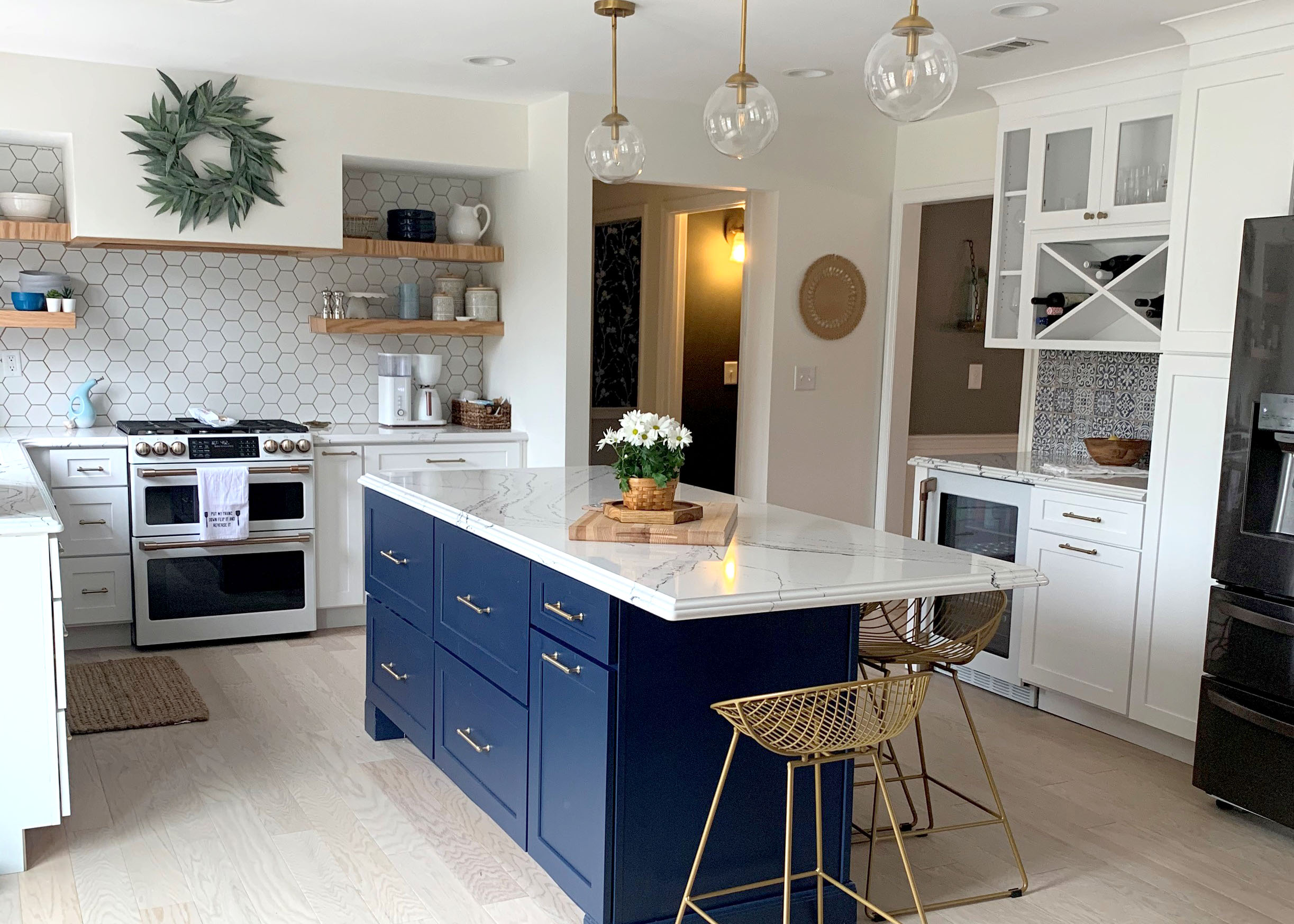 Farmhouse style white shaker kitchen cabinets and blue island with gold hardware Farmhouse style white shaker kitchen cabinets and blue island with gold hardware