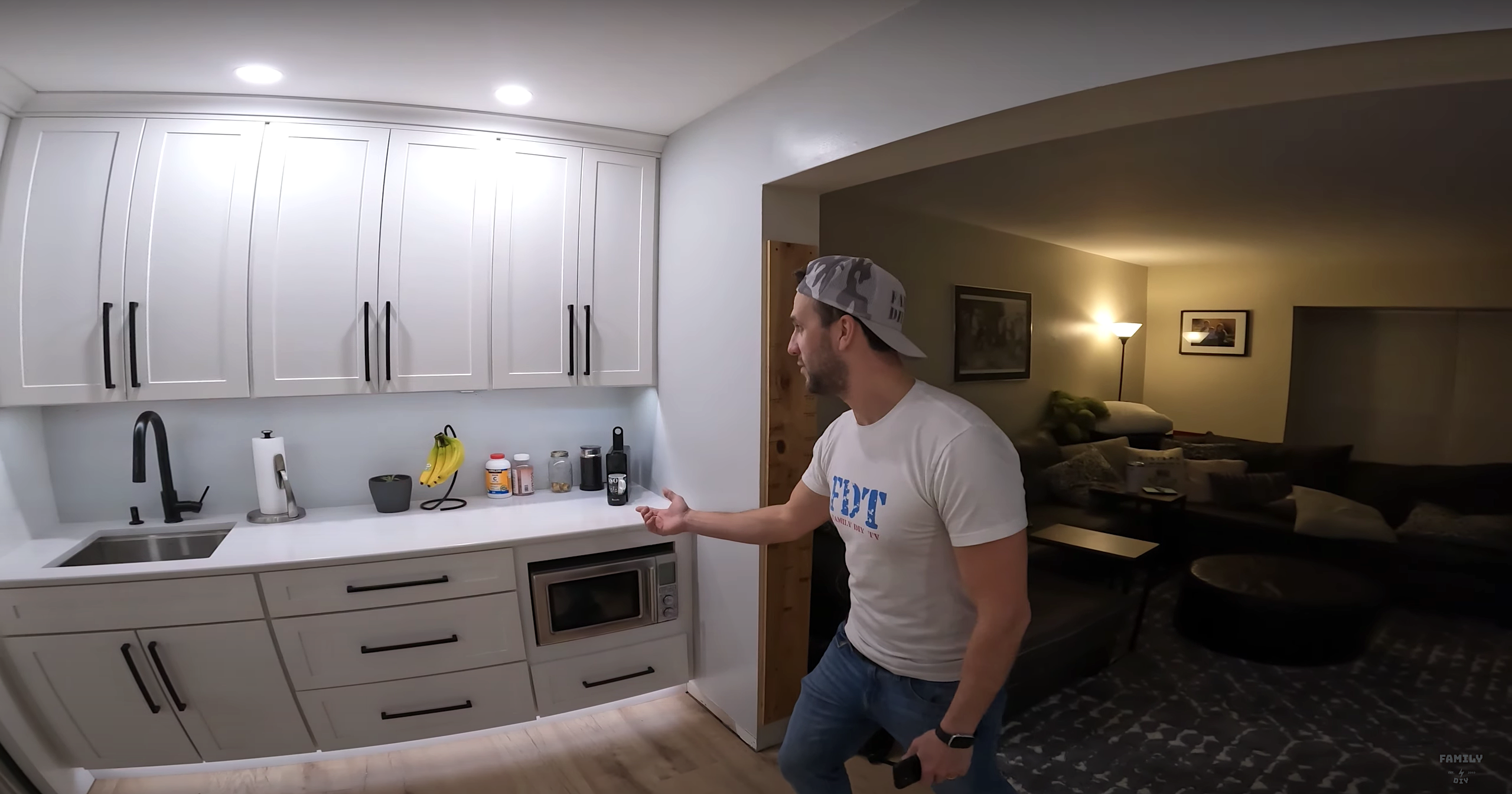Refrigerator wall of white shaker kitchen cabinets with under cabinet lighting and toe kick lighting Refrigerator wall of white shaker kitchen cabinets with under cabinet lighting and toe kick lighting