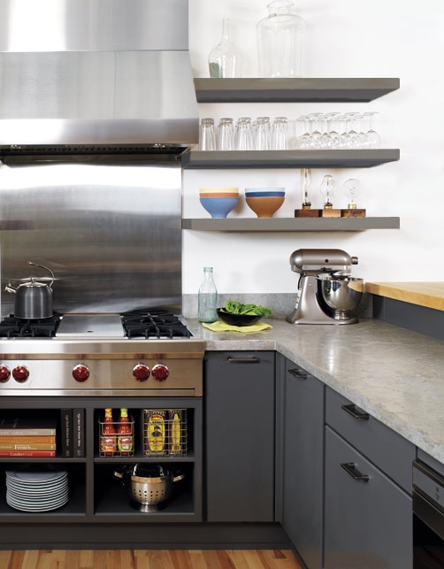 modern gray kitchen with slab door cabinets, floating shelves and stainless pro cooktop and range hood and backsplash modern gray kitchen with slab door cabinets, floating shelves and stainless pro cooktop and range hood and backsplash