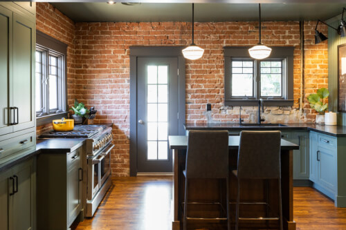 Green kitchen cabinets with dark brown island Medium tone wood kitchen cabinets in green with dark brown island