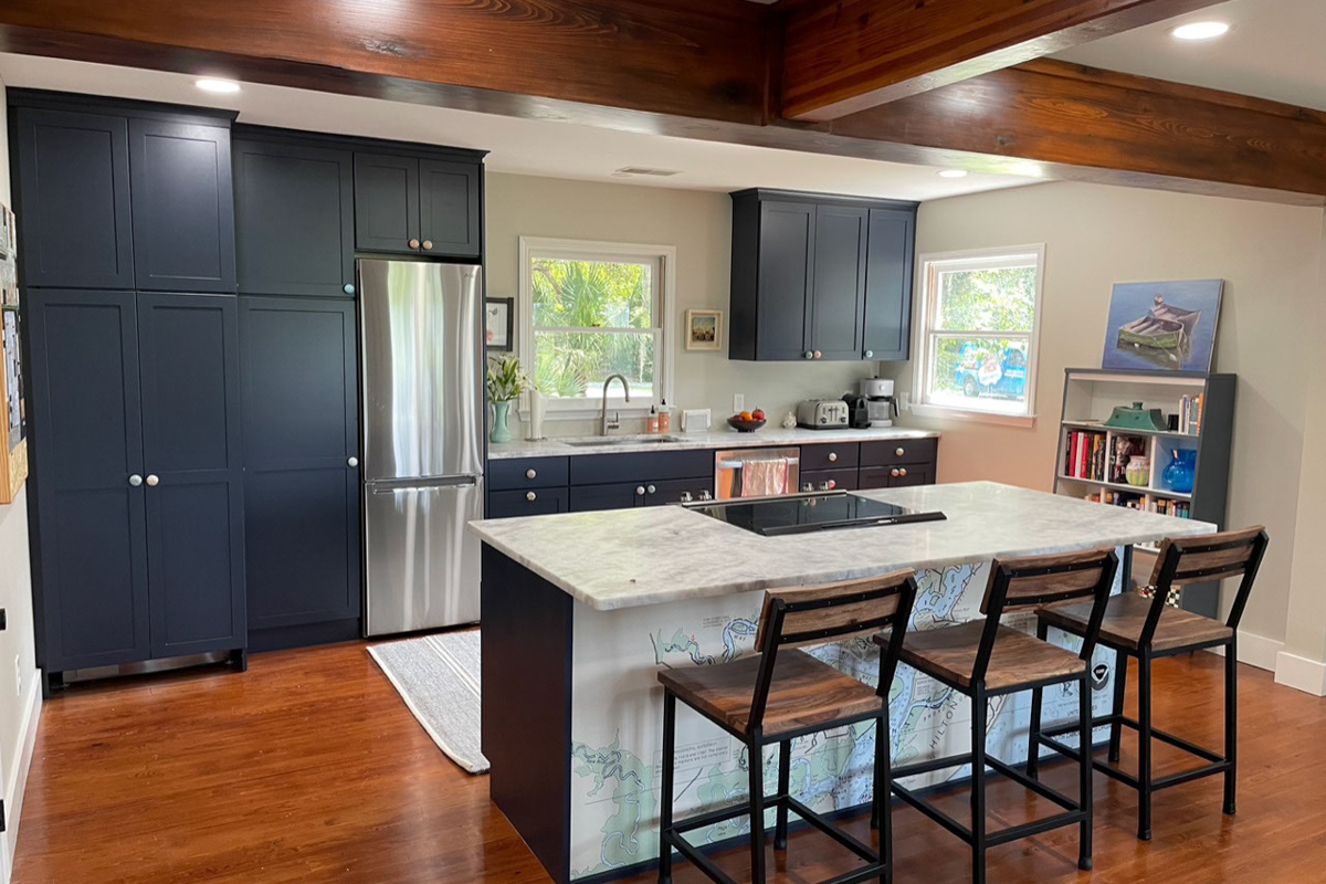 Dark navy blue shaker kitchen design with nautical theme and light quartz countertops Dark navy blue shaker kitchen design with nautical theme and light quartz countertops