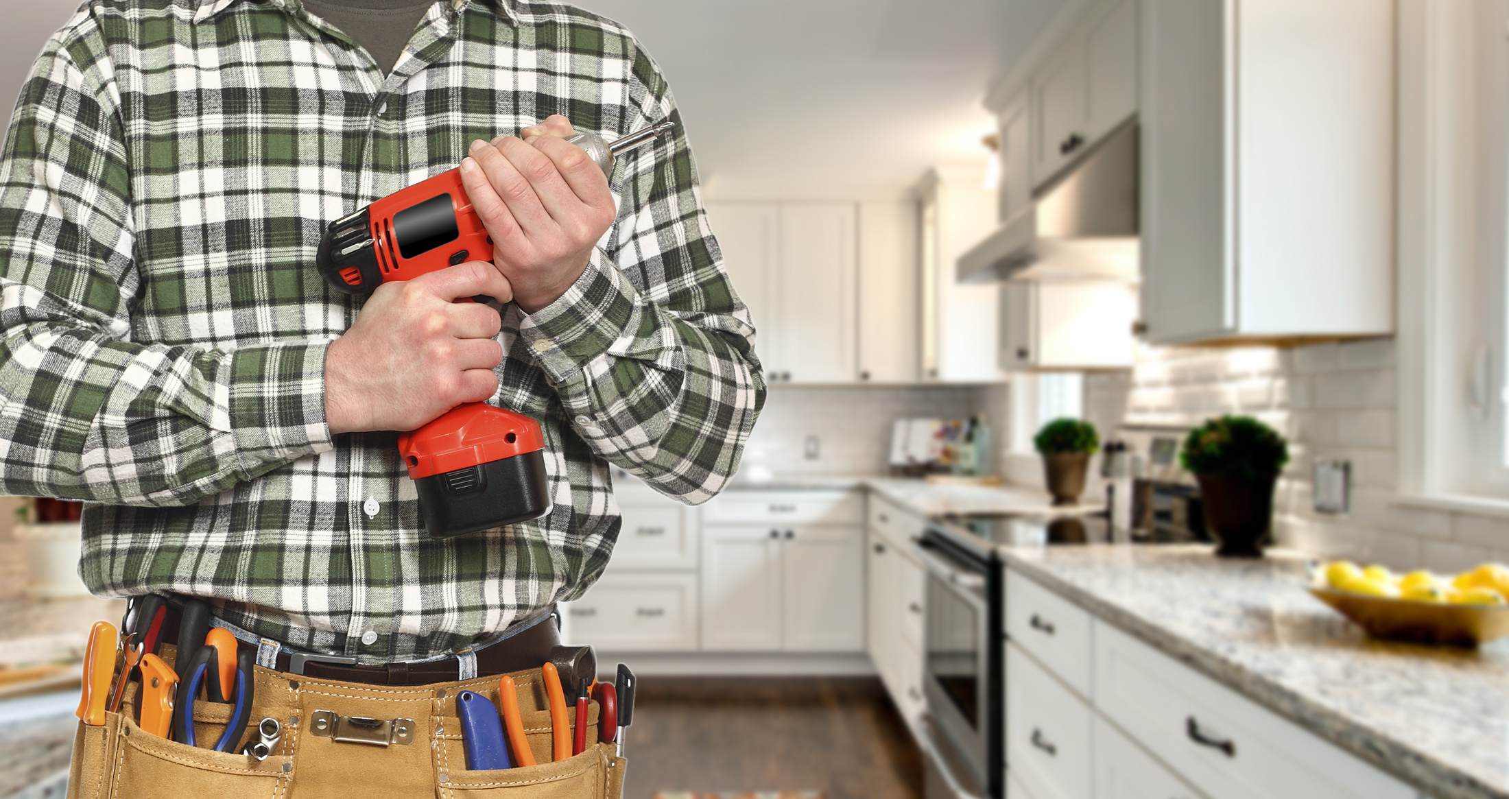 Contractor with power drill ready to install white shaker kitchen cabinets Contractor with power drill ready to install white shaker kitchen cabinets