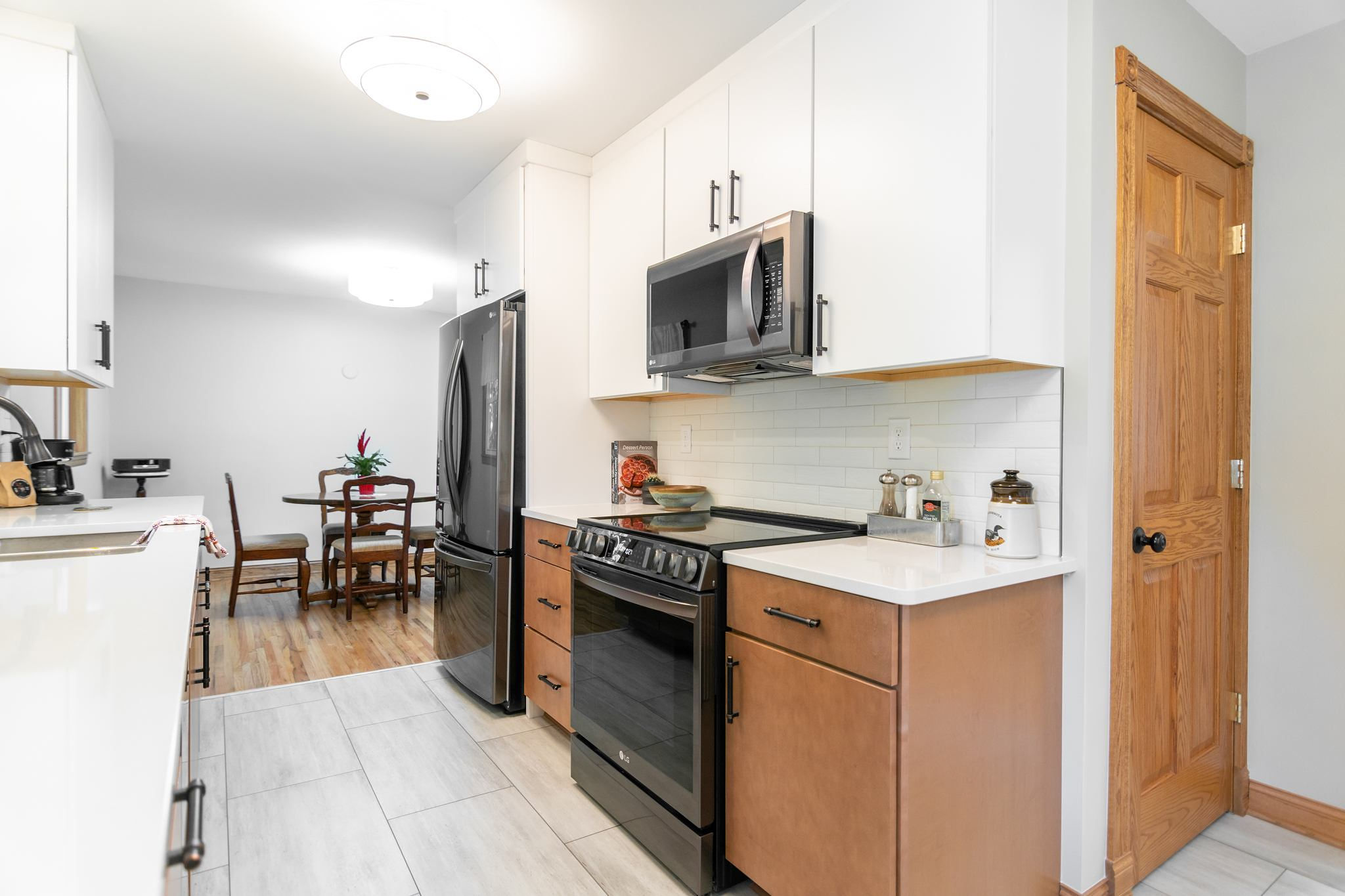 CliqStudios project: White and natural wood slab kitchen cabinets with white subway tile backsplash CliqStudios project: White and natural wood slab kitchen cabinets with white subway tile backsplash