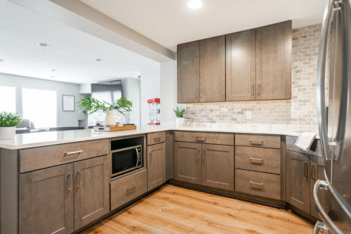 Kirby Timber kitchen cabinets U-shaped basement bar with dark brown kitchen cabinets and brushed nickel cabinet pulls