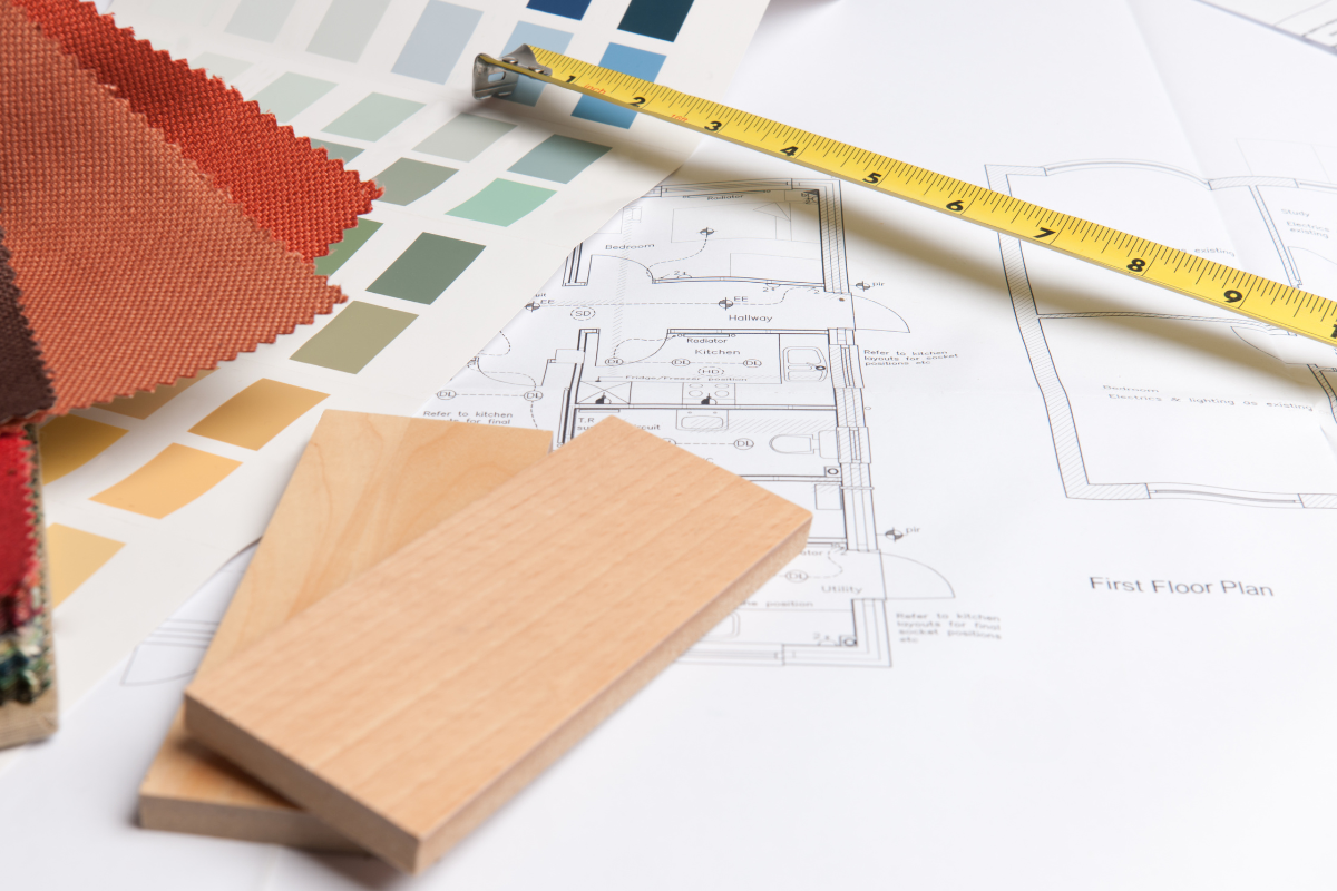 Wood and paint samples laid out on a table with a tape measure Wood and paint samples laid out on a table with a tape measure