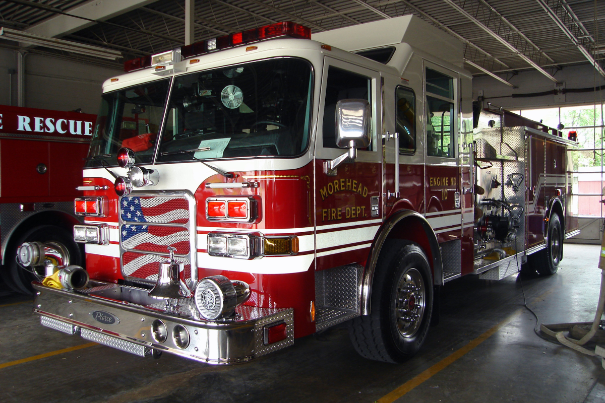 Morehead fire department red fire truck with an American flag on the front Morehead fire department red fire truck with an American flag on the front