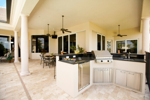 Stucco outdoor kitchen surround with stainless steel outdoor kitchen cabinets 