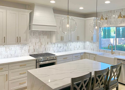 Tapered shiplap wood range hood in White against white shaker kitchen cabinets Tapered shiplap wood range hood in White against white shaker kitchen cabinets