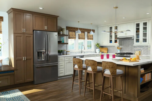 Two-tone white and medium-brown stained kitchen White and medium tone wood kitchen cabinets with glass wall cabinets