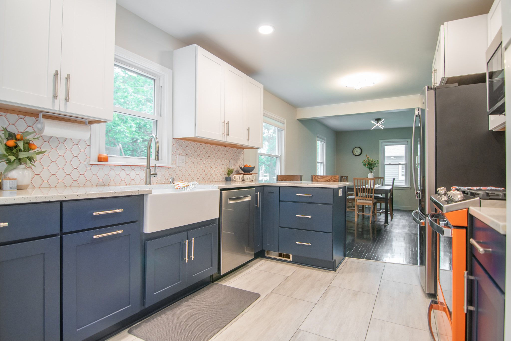 CliqStudios project: White and blue shaker kitchen cabinets with bright orange range and backsplash grout CliqStudios project: White and blue shaker kitchen cabinets with bright orange range and backsplash grout