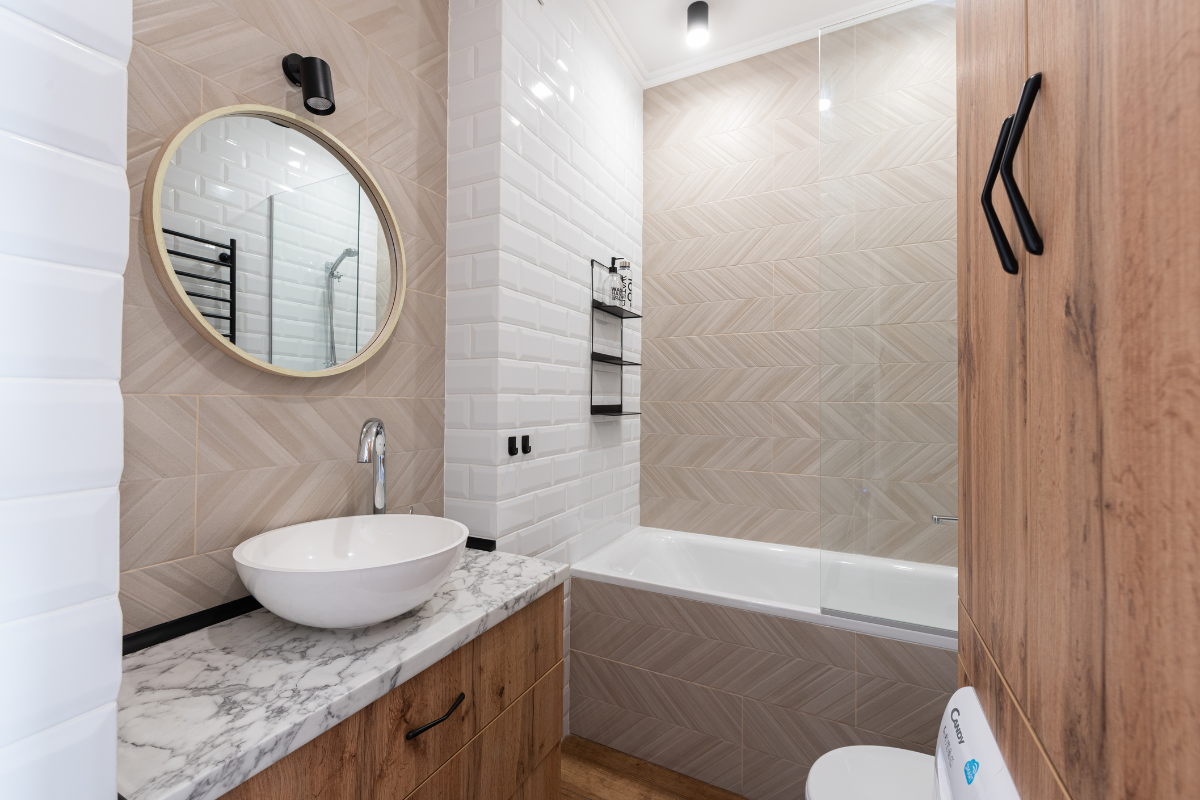 Modern organic bathroom remodel with white and neutral brown tones, a natural gray stone countertop and white vessel sink Modern organic bathroom remodel with white and neutral brown tones, a natural gray stone countertop and white vessel sink