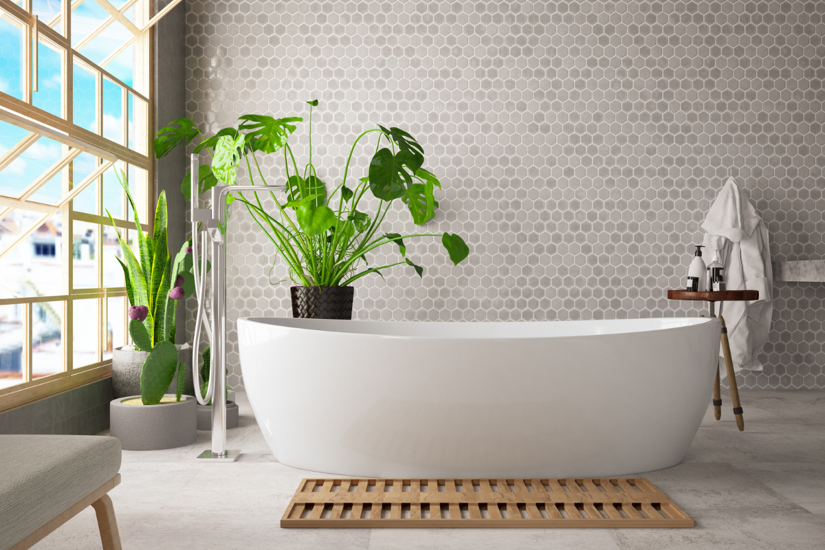 Modern organic bathroom design with white freestanding bathtub in front of focal wall with hexagon brown tiles Modern organic bathroom design with white freestanding bathtub in front of focal wall with hexagon brown tiles