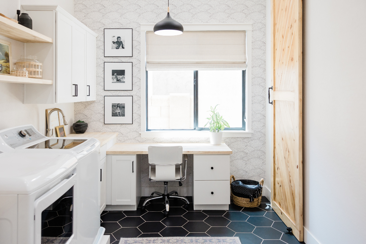 White shaker laundry room cabinets with black cabinet hardware and natural wood floating shelves White shaker laundry room cabinets with black cabinet hardware and natural wood floating shelves