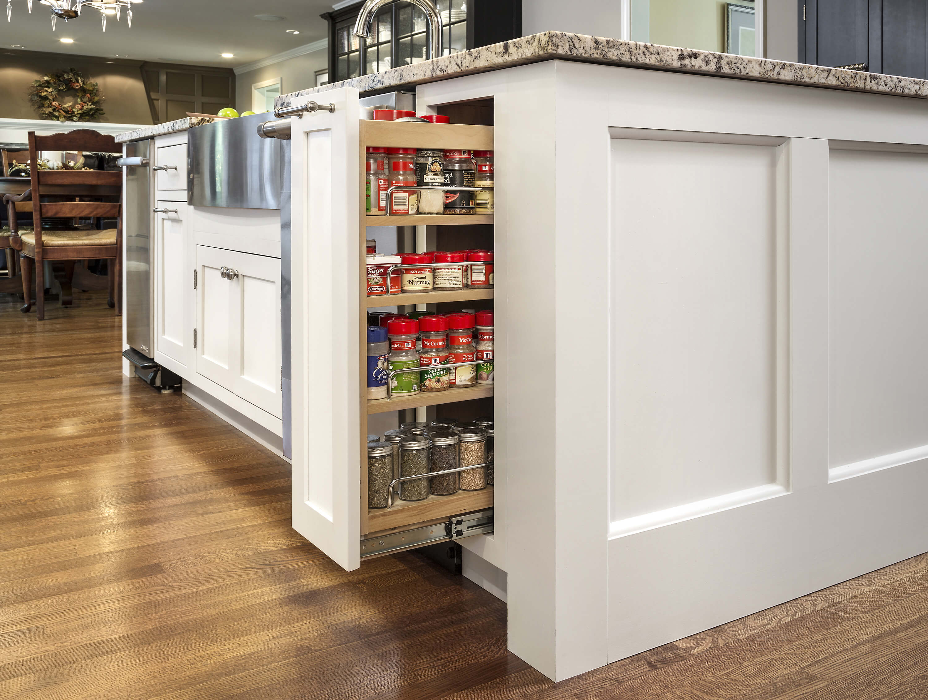 Pull-out cabinet organizers - a powerful addition to any kitchen design. This image is of pull-out cabinet organizers that are a powerful addition to any kitchen design, especially where more storage space for pantry items is desperately needed.