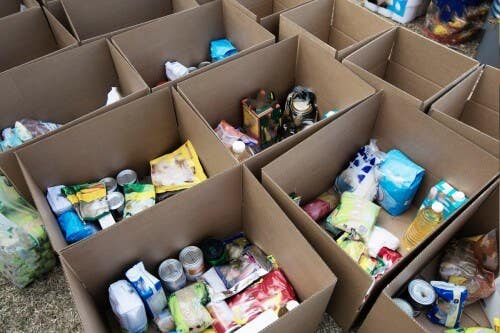 Boxes of groceries and home goods for donation Boxes of donation items