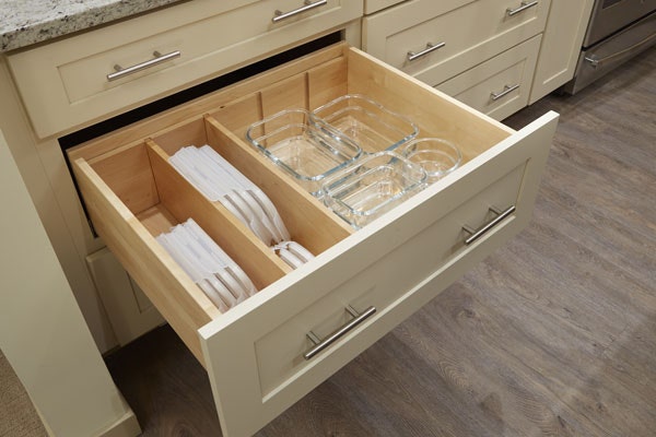 Peg drawer organizer storing plates, dishes, and bowls. Shown in CliqStudios Shaker style, Painted Light Gray