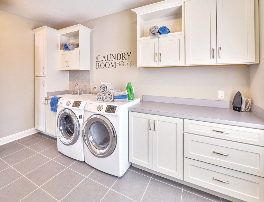 Spacious and bright laundry room custom built with CliqStudios.com shaker style cabinets. Shown Shaker cabinet style in painted White finish. Spacious and bright laundry room custom built with CliqStudios.com shaker style cabinets. Shown Shaker cabinet style in painted White finish.