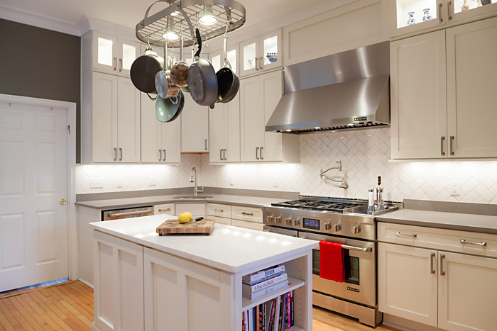 long kitchen with white cabinets and professional range long kitchen with white cabinets and professional range