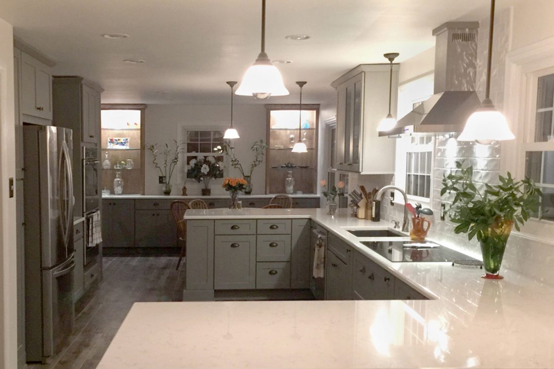 Gray kitchen with two peninsulas, stainless appliances, dining room buffet and beverage center Gray kitchen with two peninsulas, stainless appliances, dining room buffet and beverage center