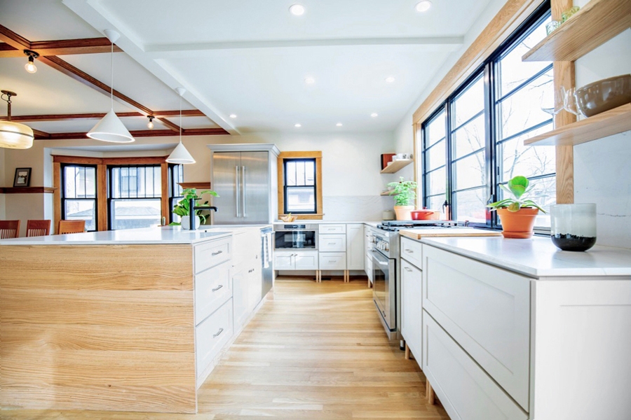 Contemporary minimal white shaker kitchen cabinets with large island and light maple wood finishes Contemporary minimal white shaker kitchen cabinets with large island and light maple wood finishes