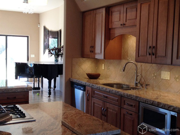 Maple kitchen cabinets by sink area Maple kitchen cabinets by sink area