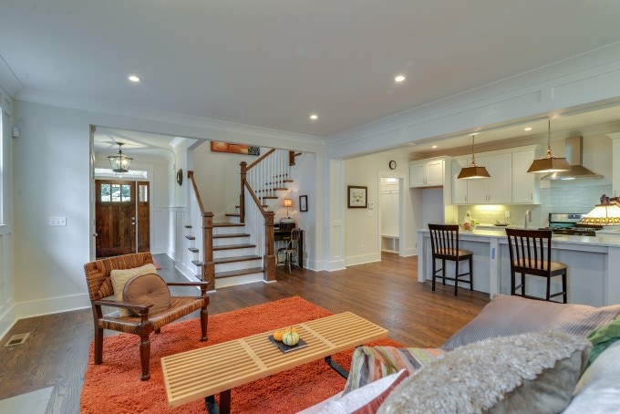 Open floor plan with white Shaker galley kitchen