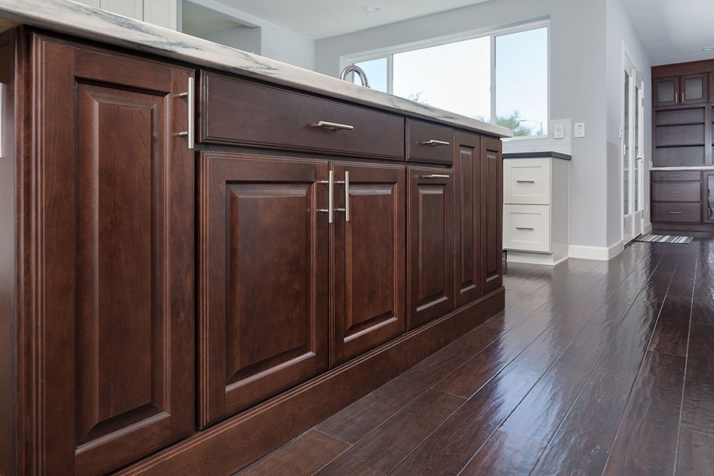 cherry cabinets with raised panel doors are used to build a kitchen center island trimmed with ogee toekick for a furniture look cherry cabinets with raised panel doors are used to build a kitchen center island trimmed with ogee toekick for a furniture look