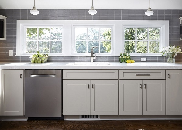Kitchen window wall with pale gray shaker cabinets and gray subway tile Kitchen window wall with pale gray shaker cabinets and gray subway tile