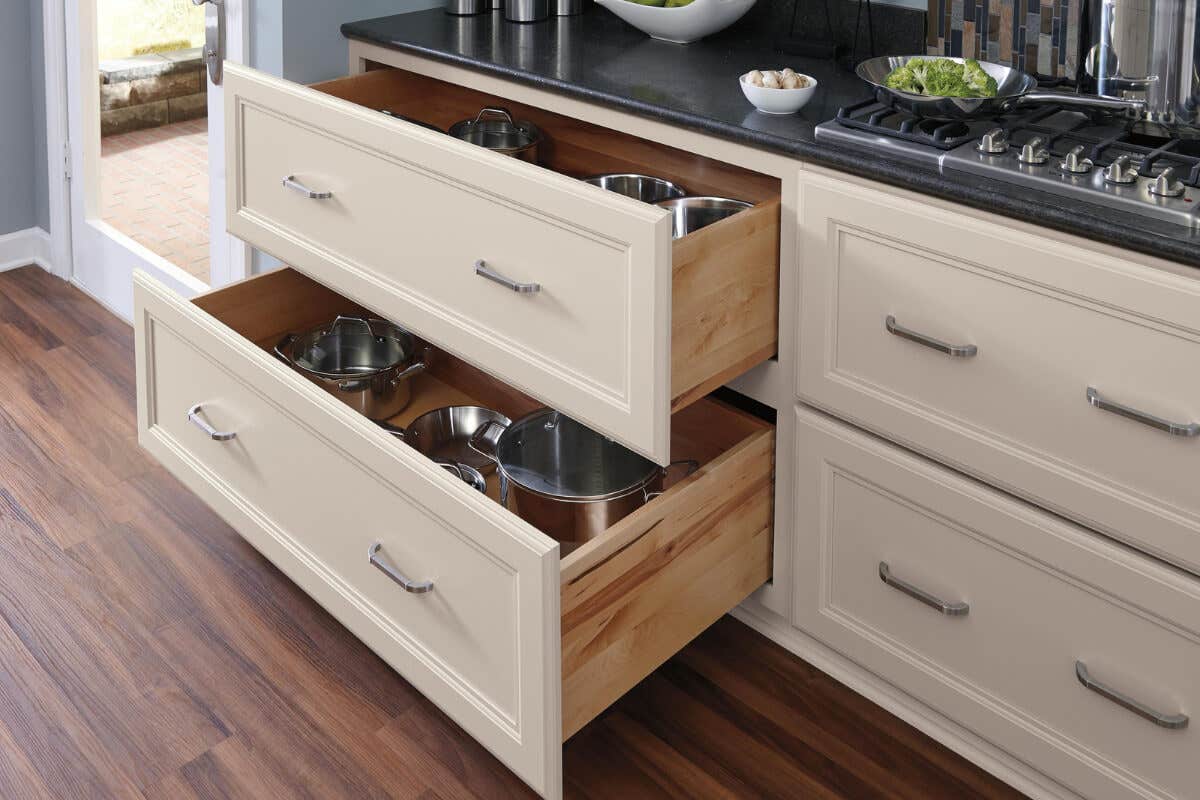 Popular Kitchen Island Upgrades to Consider Decorative cream cabinets with deep drawer storage for pots and pans