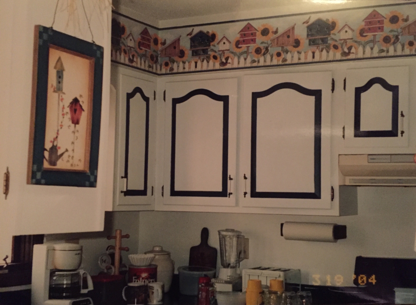 painted kitchen cabinets with cathedral doors in two-tone scheme with wallpaper trim painted kitchen cabinets with cathedral doors in two-tone scheme with wallpaper trim