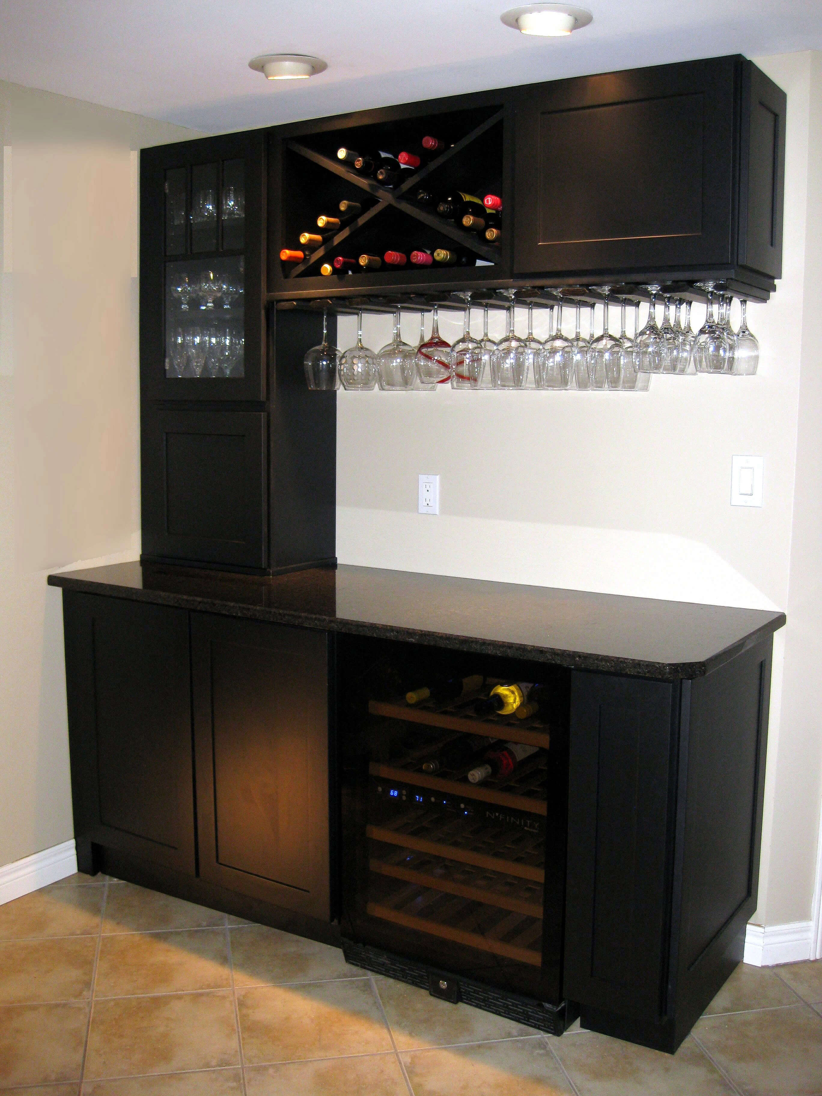 How are Bar Cabinets Different from Other Cabinets? The image is of bar cabinets in the house. Bar cabinets differ from other types of cabinets in the function they serve within the home.