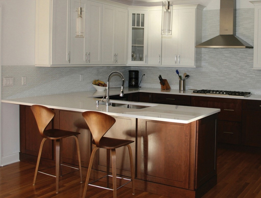 Maple base cabinets and peninsula and white shaker wall cabinets in this kitchen with peninsula u shape Maple base cabinets and peninsula and white shaker wall cabinets in this kitchen with peninsula u shape